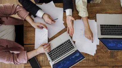 people having debate while looking computer