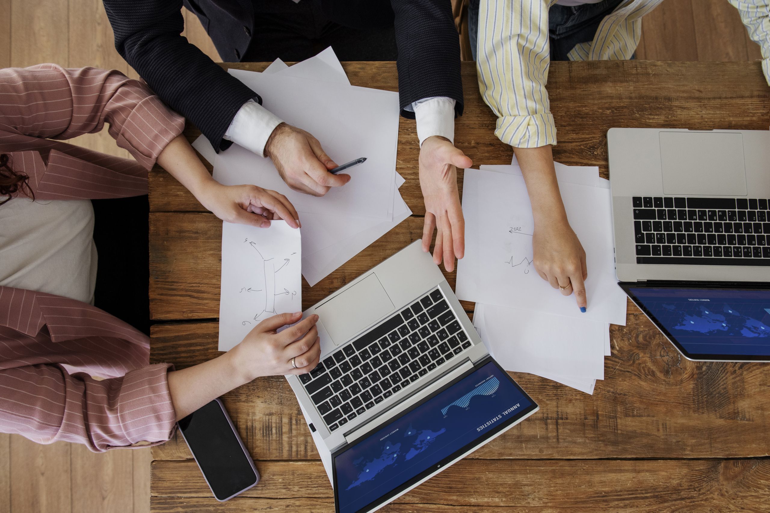 people having debate while looking computer